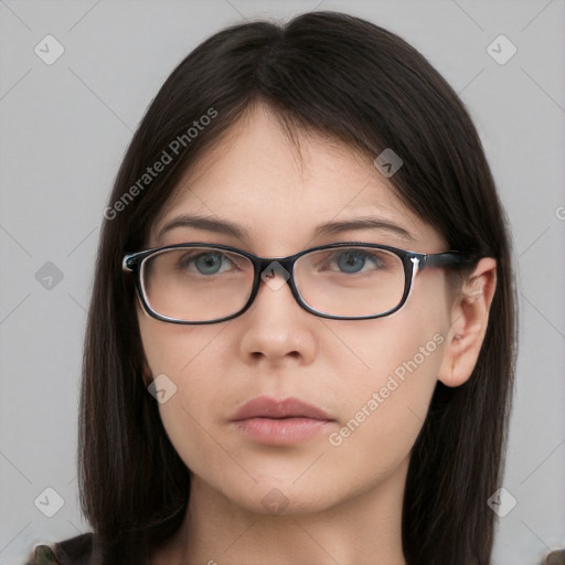 Neutral white young-adult female with long  brown hair and brown eyes