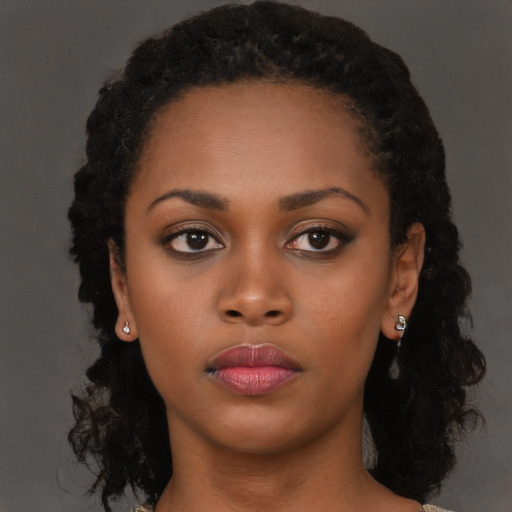 Neutral black young-adult female with long  black hair and brown eyes