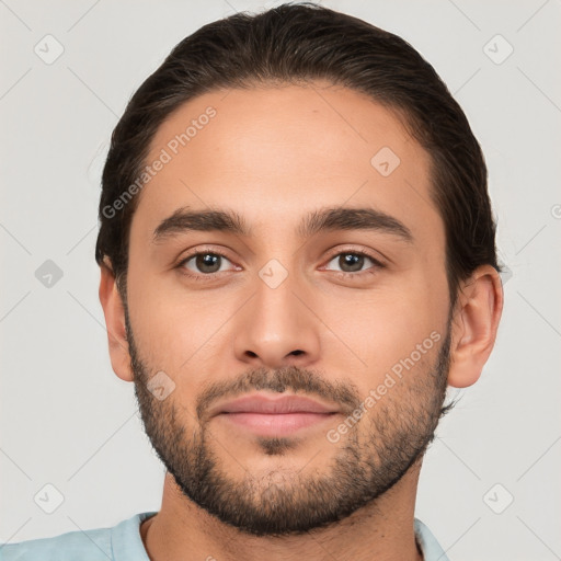 Joyful white young-adult male with short  brown hair and brown eyes