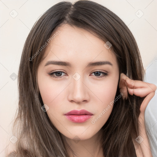 Neutral white young-adult female with long  brown hair and brown eyes