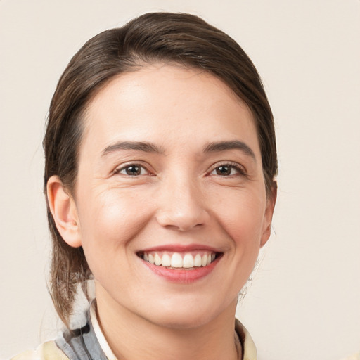 Joyful white young-adult female with medium  brown hair and brown eyes