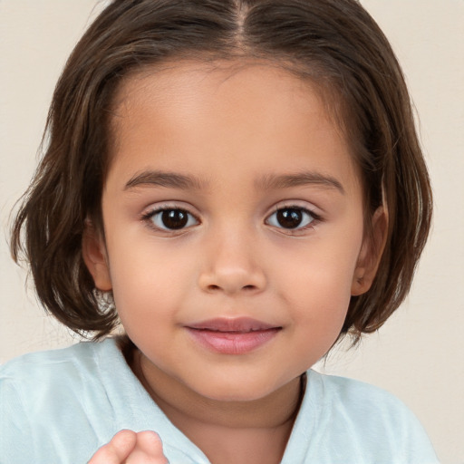 Joyful white child female with medium  brown hair and brown eyes