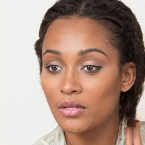 Neutral latino young-adult female with long  brown hair and brown eyes