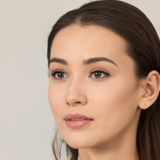 Neutral white young-adult female with long  brown hair and brown eyes