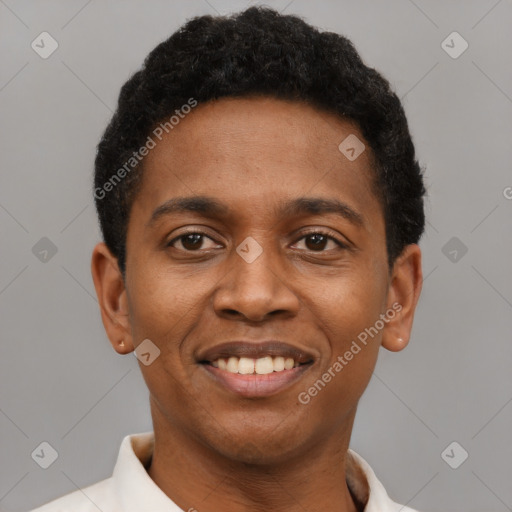 Joyful black young-adult male with short  brown hair and brown eyes