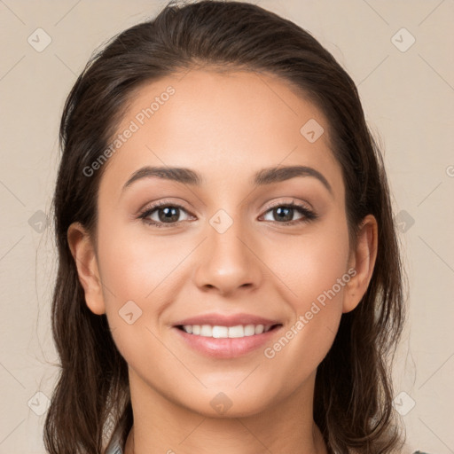 Joyful white young-adult female with long  brown hair and brown eyes