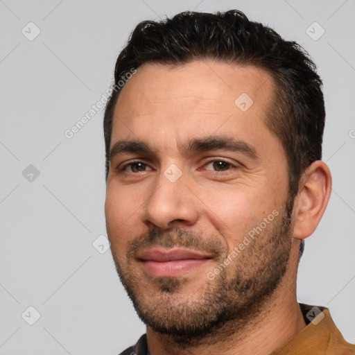 Joyful white young-adult male with short  black hair and brown eyes