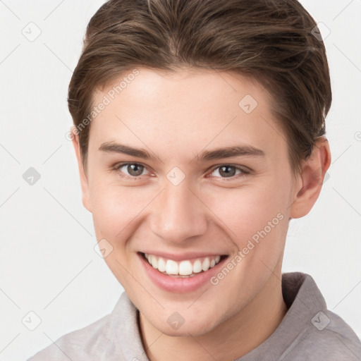 Joyful white young-adult female with short  brown hair and grey eyes