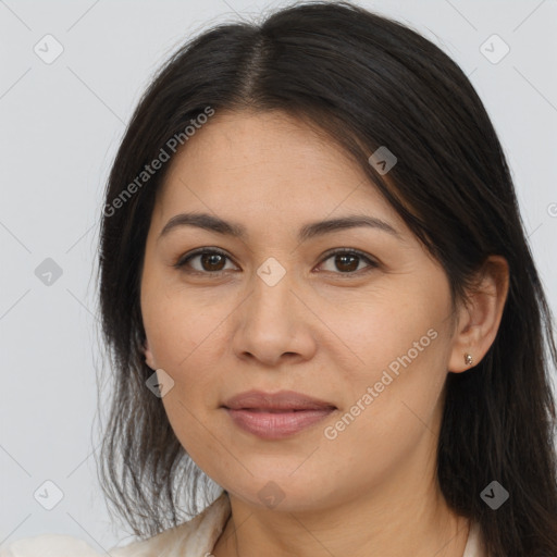 Joyful latino young-adult female with long  brown hair and brown eyes