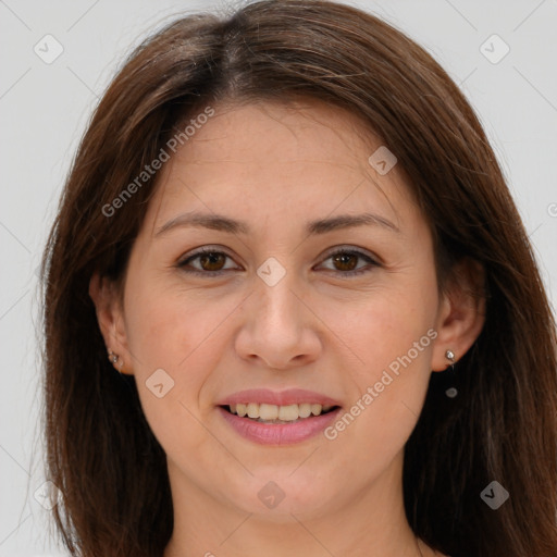 Joyful white young-adult female with long  brown hair and brown eyes