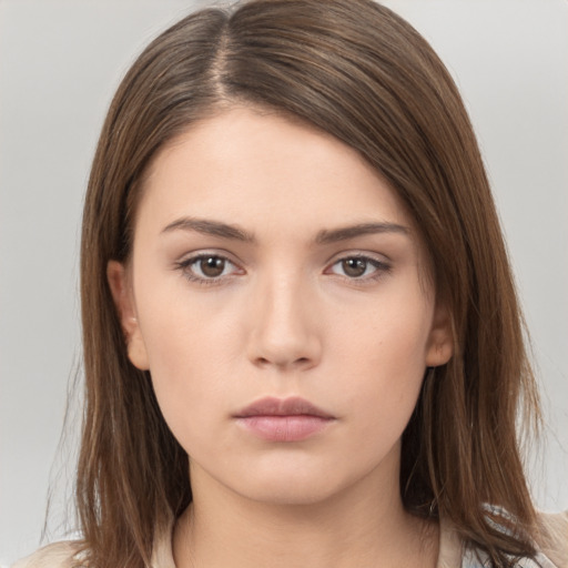 Neutral white young-adult female with medium  brown hair and brown eyes