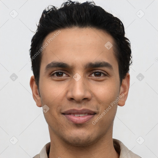 Joyful latino young-adult male with short  black hair and brown eyes