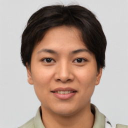 Joyful asian young-adult female with short  brown hair and brown eyes