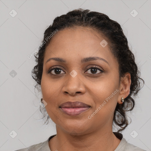 Joyful black young-adult female with medium  black hair and brown eyes