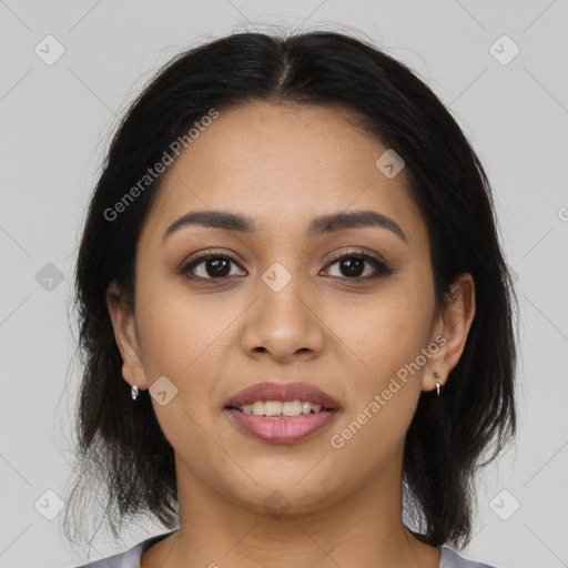 Joyful latino young-adult female with medium  brown hair and brown eyes