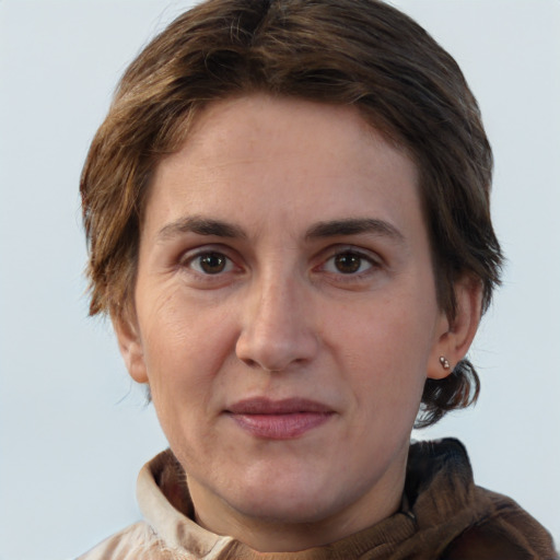 Joyful white adult female with short  brown hair and brown eyes