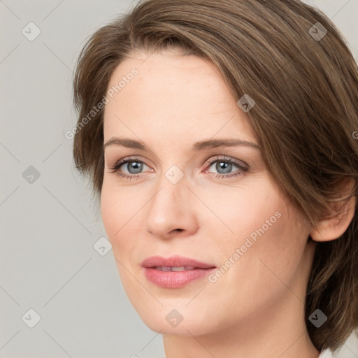 Joyful white young-adult female with medium  brown hair and green eyes