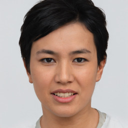 Joyful asian young-adult female with short  brown hair and brown eyes