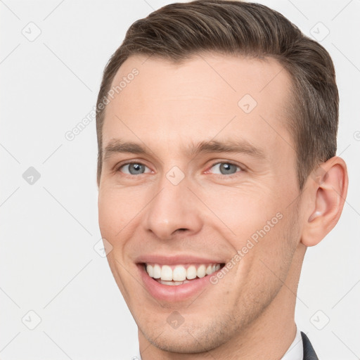 Joyful white young-adult male with short  brown hair and brown eyes