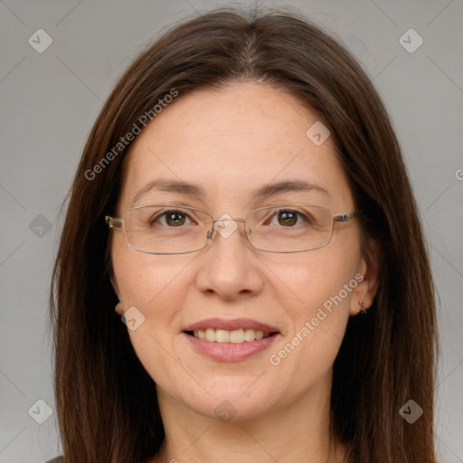 Joyful white adult female with long  brown hair and brown eyes