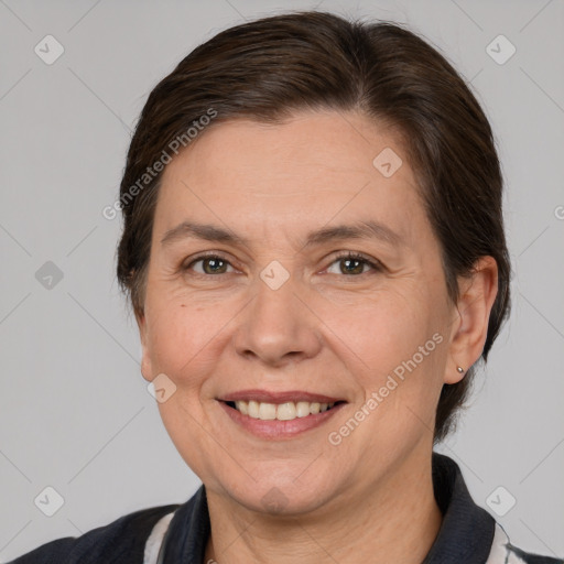 Joyful white adult female with medium  brown hair and brown eyes