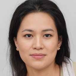 Joyful asian young-adult female with medium  brown hair and brown eyes