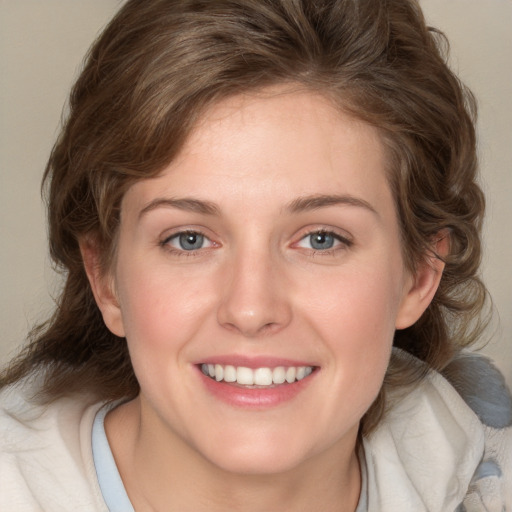 Joyful white young-adult female with medium  brown hair and blue eyes