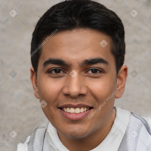 Joyful white young-adult male with short  black hair and brown eyes