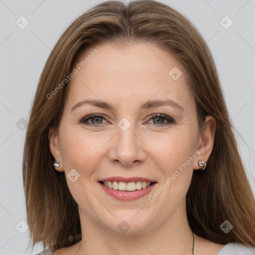 Joyful white adult female with medium  brown hair and grey eyes