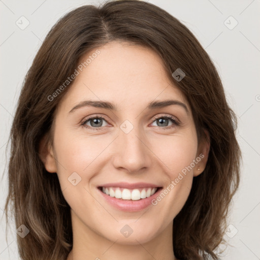 Joyful white young-adult female with long  brown hair and green eyes