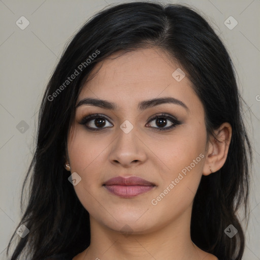 Joyful latino young-adult female with long  brown hair and brown eyes