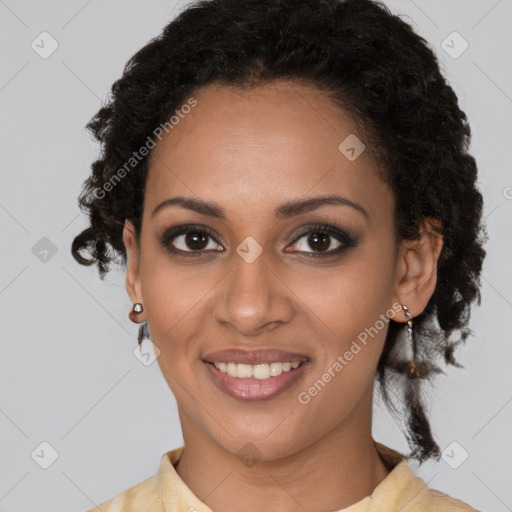 Joyful black young-adult female with medium  brown hair and brown eyes