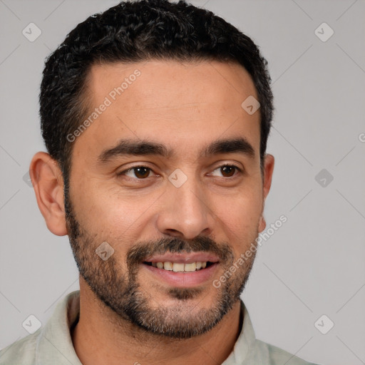 Joyful white young-adult male with short  black hair and brown eyes