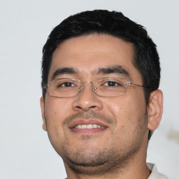 Joyful asian young-adult male with short  black hair and brown eyes