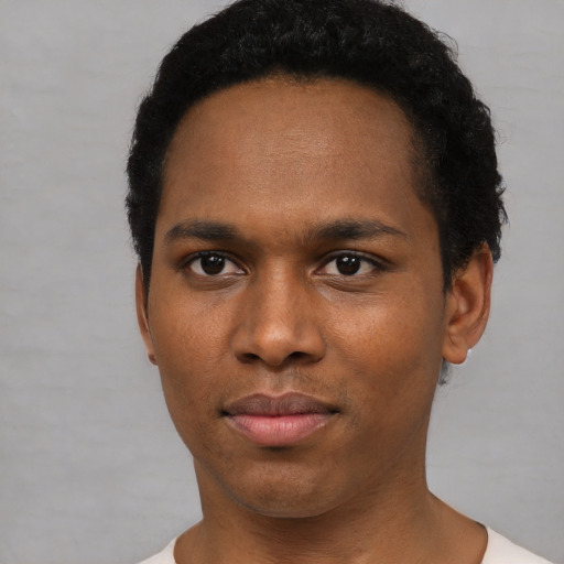 Neutral black young-adult male with short  black hair and brown eyes