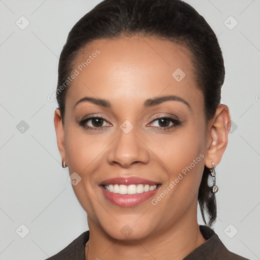 Joyful latino young-adult female with short  brown hair and brown eyes