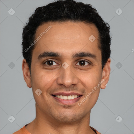 Joyful latino young-adult male with short  brown hair and brown eyes