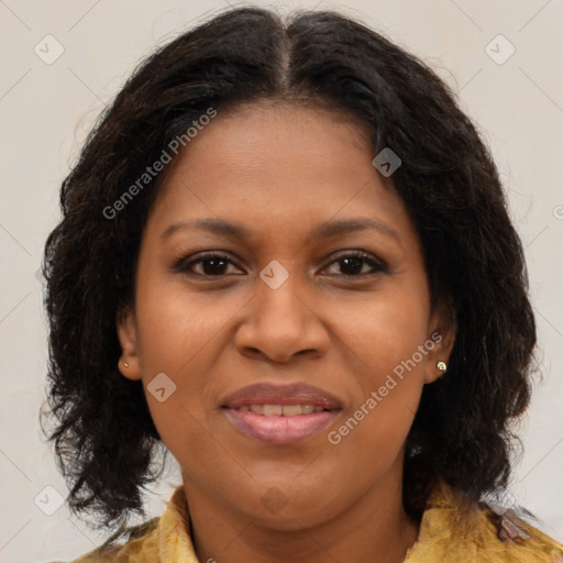 Joyful black adult female with medium  brown hair and brown eyes