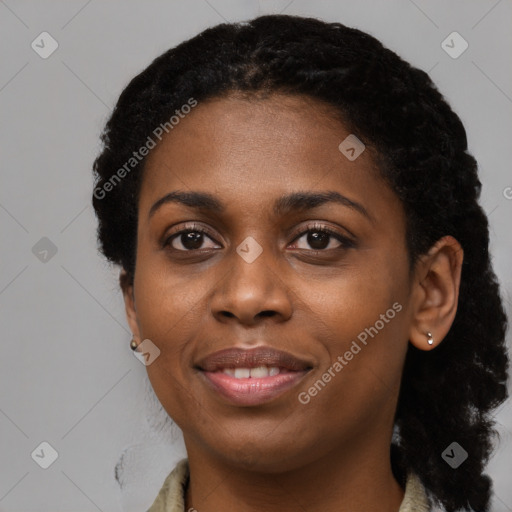 Joyful black young-adult female with short  black hair and brown eyes