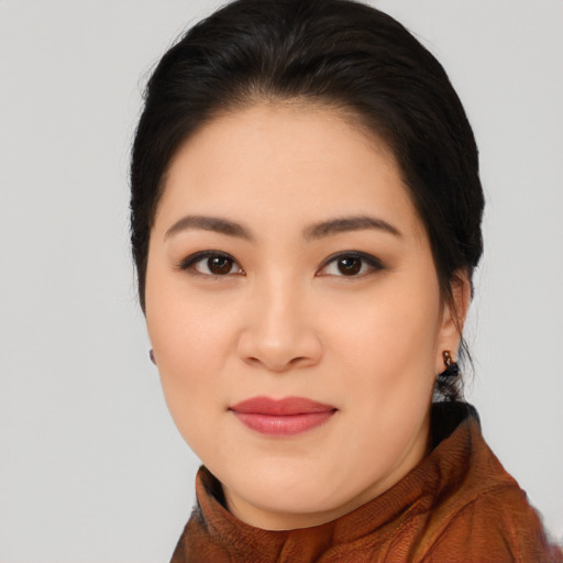 Joyful asian young-adult female with long  brown hair and brown eyes