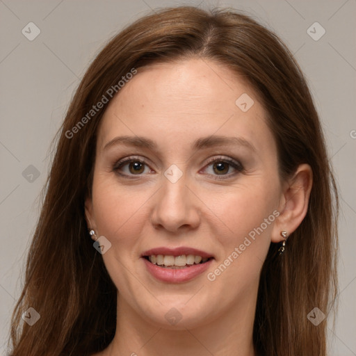 Joyful white adult female with long  brown hair and grey eyes