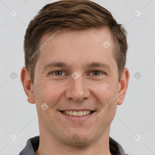 Joyful white adult male with short  brown hair and brown eyes