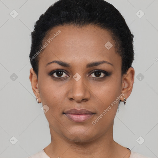 Joyful black young-adult female with short  black hair and brown eyes