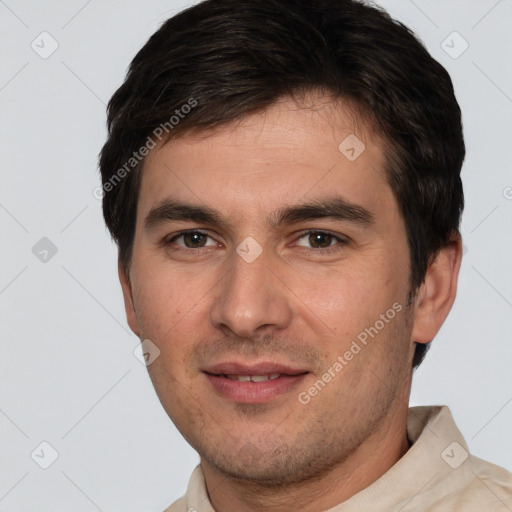 Joyful white young-adult male with short  brown hair and brown eyes