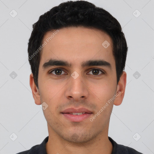 Joyful white young-adult male with short  black hair and brown eyes