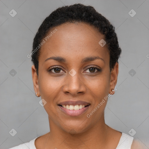 Joyful black young-adult female with short  black hair and brown eyes