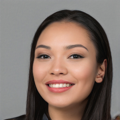 Joyful white young-adult female with long  black hair and brown eyes