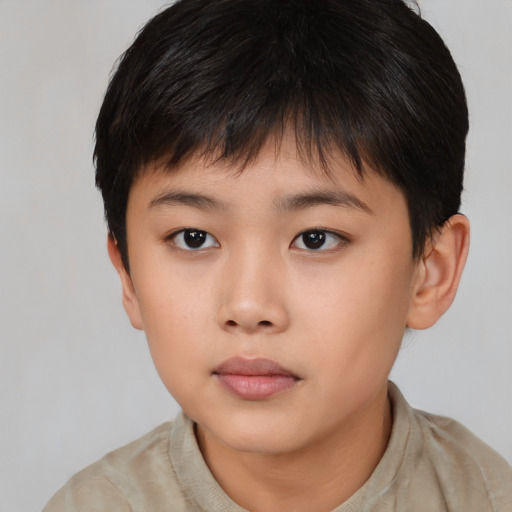 Neutral asian child male with short  brown hair and brown eyes