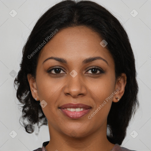 Joyful black young-adult female with medium  brown hair and brown eyes