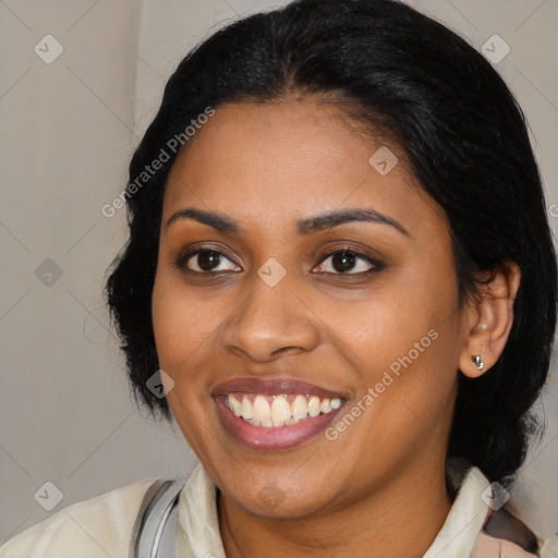 Joyful black young-adult female with medium  black hair and brown eyes